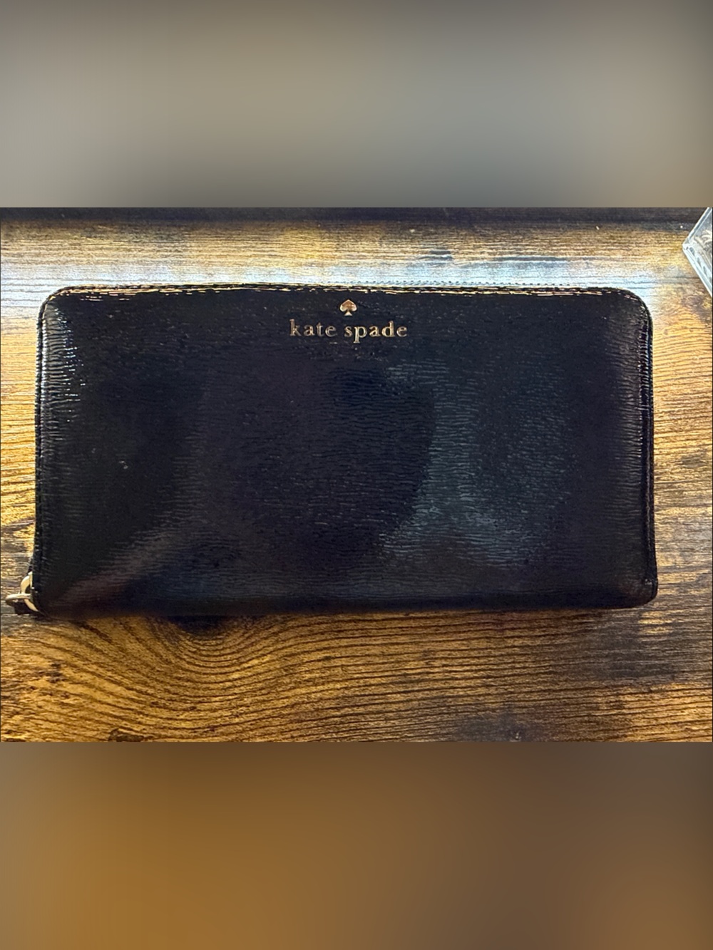 kate spade well loved black patent zip-around continental wallet with gold logo